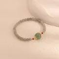 Detailed view of moonstone and green chalcedony pumpkin bead bracelet in elegant style - Green Pumpkin Bead Style