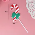 Decoración de pastel de bastón de caramelo de Navidad con rayas rojas y lazo verde - Estilo Bastón con Lazo