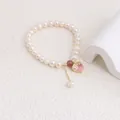 Detailed view of natural freshwater pearl bracelet with pink heart crystal pendant. - Pink Rhinestone Heart Style