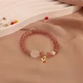 Elegant strawberry quartz beaded bracelet featuring moonstone cat paw and pearl charms - Cat Paw Style