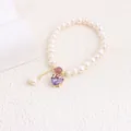 Detailed view of natural pearl bracelet featuring a purple heart zircon pendant - Purple Rhinestone Heart Style