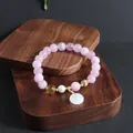 Close-up of pink crystal bead bracelet with white jade pendant and freshwater pearl - Kunzite Ping'an Buckle Bracelet