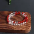 Detailed macro view of a double-layered natural red agate and clear quartz beaded bracelet - Red Agate Moonstone Double Layer Bracelet
