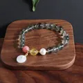 Detailansicht eines Armbands im neuen chinesischen Stil mit grünem Quarz und Jade - Grüner Phantom Ping An Kou Armband