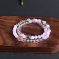 Detailed view of a double-strand natural crystal bracelet with lavender and clear beads. - Kunzite Moonstone Double Layer Bracelet