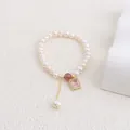 Elegant freshwater pearl bracelet featuring a pink zircon pendant and gold accents. - Pink Square Rhinestone