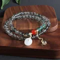 Elegante pulsera multihilo de piedra natural con cuentas de cristal y colgante de jade - Pulsera Fantasma Verde Ping An Kou