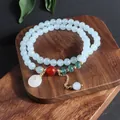 Pulsera retro de piedra natural multicapa con cuentas azul claro y colgante Ping'an Kou blanco - Pulsera de Hebilla de Paz Estilo Aguamarina