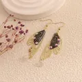 Elegant gold cicada butterfly wing drop earrings with black finish and iridescent stones - Gold Frame / Black and White Line
