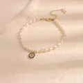Natural freshwater pearl bracelet featuring a blue zircon evil eye charm for women - Evil Eye Freshwater Pearl Bracelet