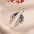 Elegant blue gradient cicada wing earrings with iridescent rhinestones and silver hooks - Silver Frame / Light Blue