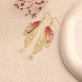 Elegant golden cicada wing earrings with reddish gradient resin and sparkling rhinestones - Gold Frame / Pink