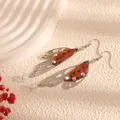 Elegant long butterfly cicada wing dangle earrings with orange resin and rhinestones - Silver Frame / Amber
