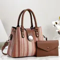 Detail view of the 2-piece handbag set including a woven tote and matching brown pouch - 28*13*21cm / Pink