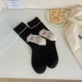 Cute black cotton mid-tube socks featuring a cartoon sheep illustration and green stripe detail - Black Lamb Style / Black
