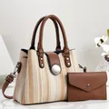 Detailed view of the woven straw handbag set with brown leather accents and matching clutch - 28*13*21cm / Khaki
