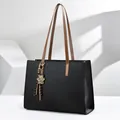 Professional detail view of a large black laptop tote bag with leopard print bear charm - 40*14*30 / Black