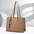 Detailed view of brown pebbled leather laptop tote bag with leopard charm - 40*14*30 / Khaki