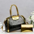 Detailed view of two-piece luxury handbag set with embossed floral design and gold trim - 29*13*22 / Gold