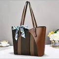 Close-up detail of a large capacity brown patchwork tote bag with a decorative silk scarf. - 32x11x28cm / Coffee