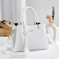 Elegant white textured leather ladies handbag with tassel charm and gold hardware accents - 28*12*19 / White Style 1