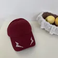 Maroon baseball cap with white embroidered lightning bolt design - 56-59cm / Adjustable / Burgundy