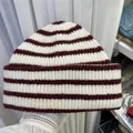Stylish retro burgundy and white striped knitted beanie hat for warm winter wear. - 56-60cm / White