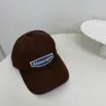 Dark brown quick-dry baseball cap featuring a blue embroidered Alauerva brand patch - 56-58cm / Brown