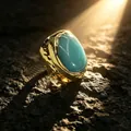 Close-up of a chunky gold ring with a large oval amazonite stone under dramatic sunlight - Adjustable Open / Amazonite Style