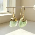 Detailed macro view of natural raw green fluorite earrings with elegant gold-plated hooks - Drop Earrings / Green Fluorite
