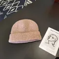 Close-up view showing the soft ribbed texture of this light pink winter knitted beanie cap - Approx. 56-58cm (Elastic) / Round Cuffed Landlord Hat / Pink Khaki