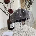 Detailed view of a grey wool beret featuring elegant white pearls and a black net veil detail - 54-58cm / Pearl Mesh Style / Dark Gray