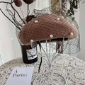 Detail view of brown wool beret with white pearls and black mesh veil decoration - 54-58cm / Pearl Mesh Style / Camel