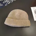 Close-up macro view of the soft ribbed knit texture on a classic beige docker beanie skull cap - Approx. 56-58cm (Elastic) / Round Cuffed Landlord Hat / Khaki