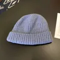 Close-up detail of a soft blue men's winter warm knitted beanie hat with ribbed texture - Approx. 56-58cm (Elastic) / Round Cuffed Landlord Hat / Haze Blue