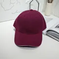 Close-up view of a minimalist burgundy twill baseball cap with a white sandwich brim - 55-60cm / Wine Red with Contrast Trim
