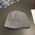 Close-up of a premium grey knitted beanie featuring soft ribbed texture and a classic folded brim - Approx. 56-58cm (Elastic) / Round Cuffed Landlord Hat / Deep Heather Grey