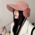 Stylish pink knitted winter hat for women with plush earmuffs and protective brim - 56-60cm / Pink