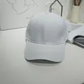 Detailed front view of a minimalist white baseball cap featuring a clean stitched curved brim - 55-60cm / White with Contrast Trim
