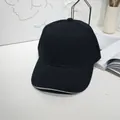 Classic black baseball cap with white sandwich trim detail in minimalist lifestyle room. - 55-60cm / Black with Contrast Trim
