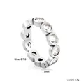 Macro view of a silver-toned eternity ring with 5mm width and cubic zirconia stones - Round Style (RI1789A6-8S)