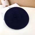Detailed top view of a classic navy blue wool felt beret for women on white background - 55-58cm (Stretchy) / Beret / Navy Blue