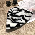 Close-up detail showing the soft plush texture of a black and white zebra-print bucket hat - 55-58cm / White