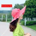 Watermelon red straw sun hat with large wavy brim and decorative bow accessory - Watermelon red