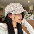 Stylish blue and beige patterned knit newsboy cap for women in a cozy cafe setting - 56-58cm / Heart Snowflake / Off White