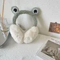 Detail of cute frog-themed plush earmuffs in a cozy indoor lifestyle setting for winter - One Size(Adjustable) / Light Green