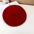 Close-up top view of a vibrant red wool beret showing felt texture and classic shape - 55-58cm (Stretchy) / Beret / Red