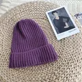 Close-up view of a cozy purple ribbed knit beanie hat for the winter season fashion - 54-58cm / Purple