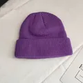 Detailed view of a purple knitted beanie featuring a premium vertical rib stitch texture - One Size / Taro Purple