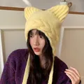 Cute yellow knitted cat ear hat for women featured on an Asian model in indoor setting - 56-60cm / Yellow